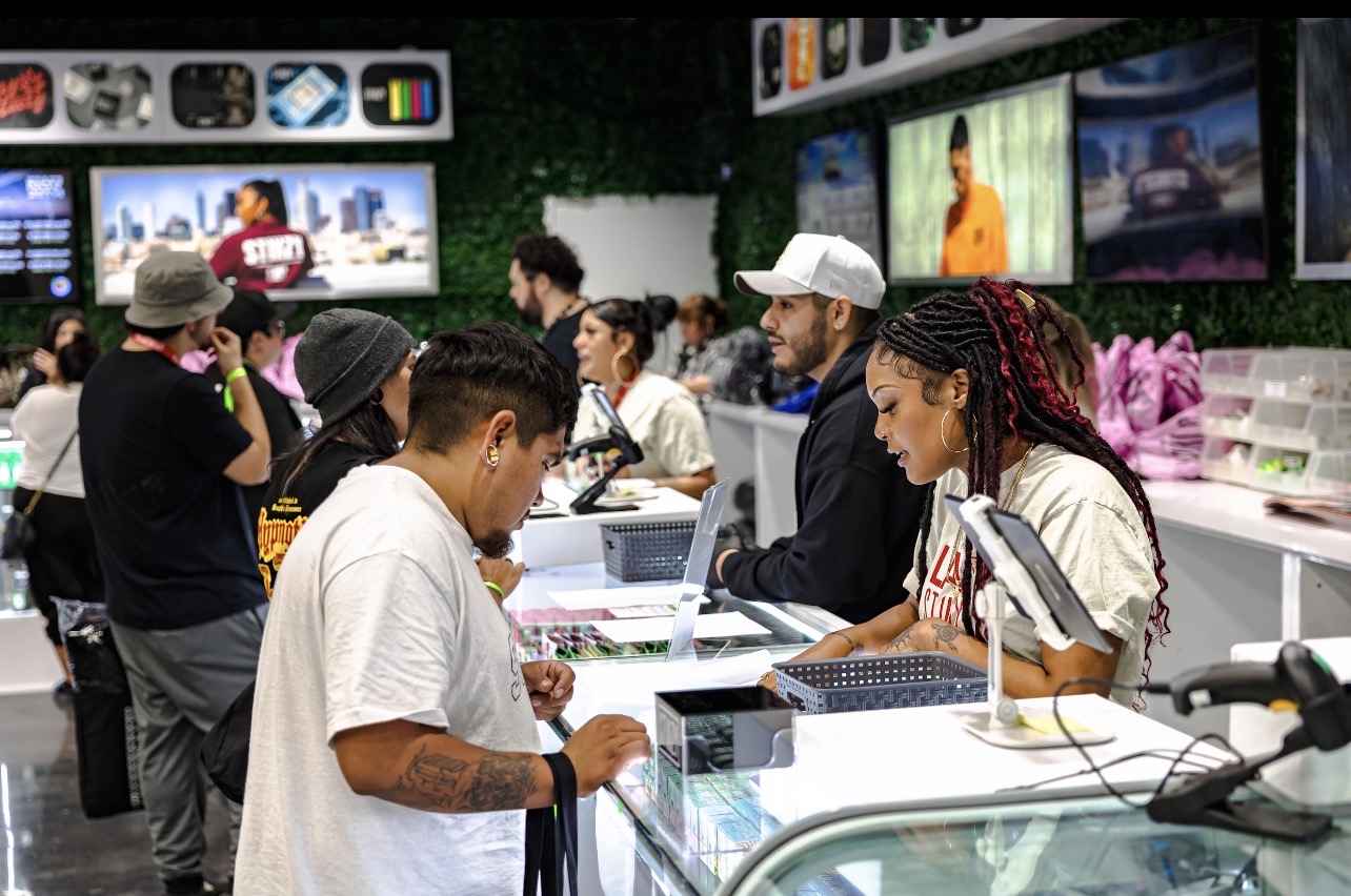 Busy customer interaction at grand opening retail counter
