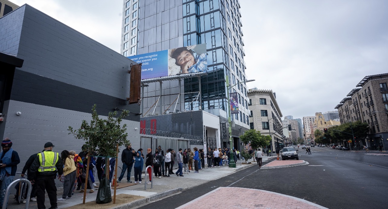 Grand opening line along a downtown block