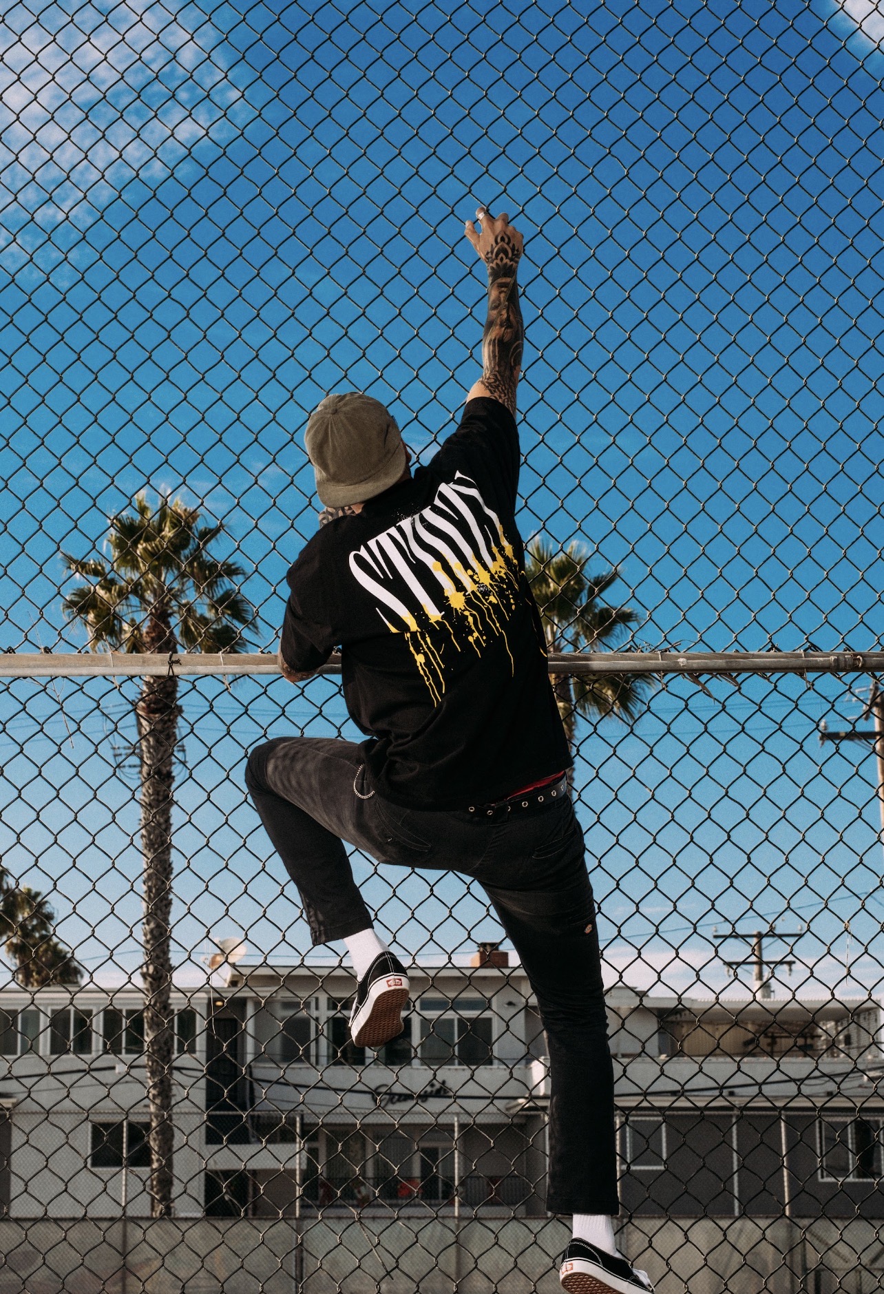 STIIIZY chain-link fence lifestyle portrait