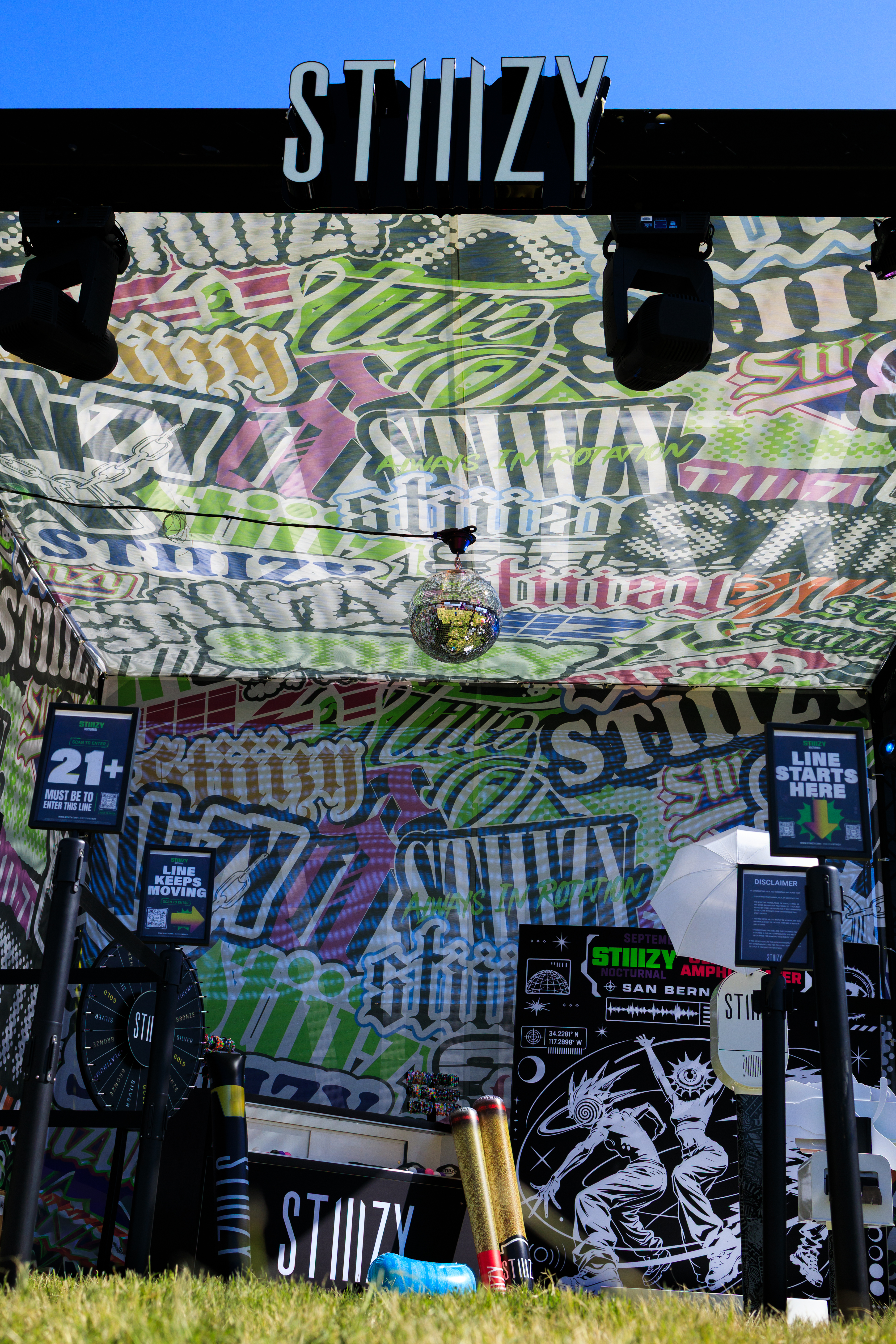 Empty Nocturnal booth showing ceiling graphics, lighting and front elevation
