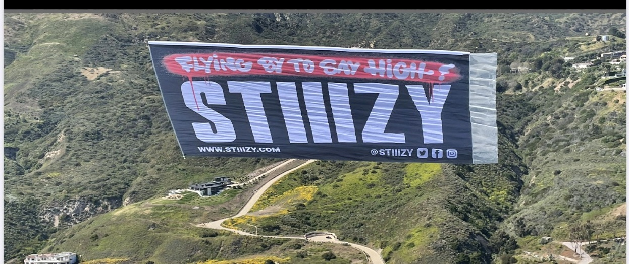 STIIIZY aerial banner flown above the coast