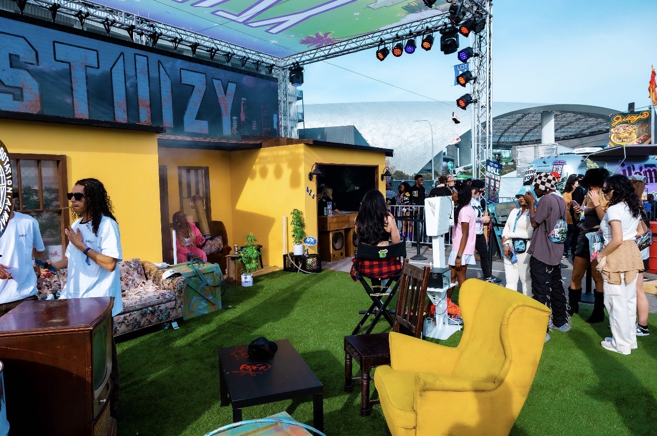 2025 STIIIZY Rolling Loud festival booth with yellow seating